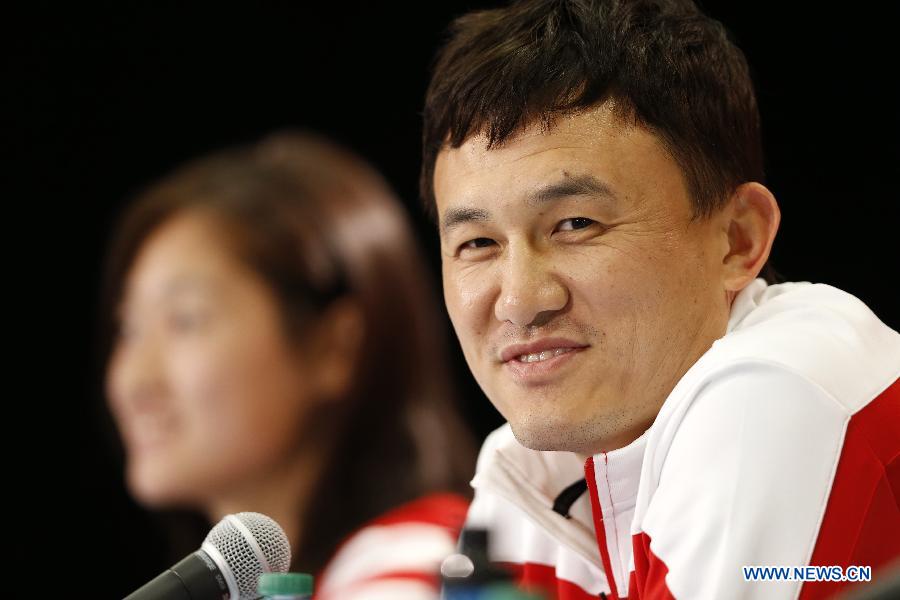 China's head coach Hao Wei attends a press conference at the Commonwealth Stadium in Edmonton, Canada, June 5, 2015. 