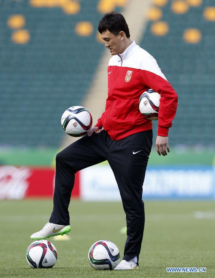 China's head coach Hao Wei attends a training session at the Commonwealth Stadium in Edmonton, Canada, June 5, 2015. 