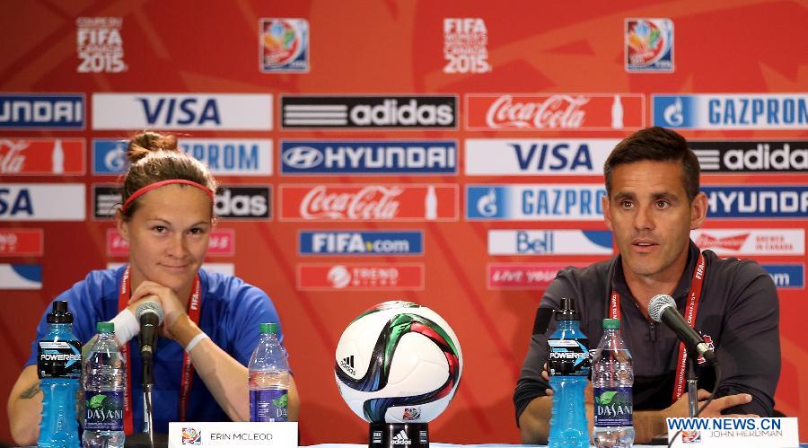 Canada's head coach John Herdman (R) and goalkeeper Erin McLeod attend a press conference in the Commonwealth Stadium one day ahead of the opening match with China at the 2015 FIFA Women's World Cup in Edmonton, Canada, June 5, 2015.