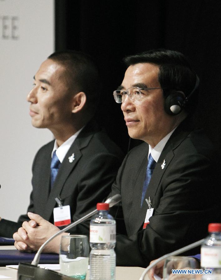 Wang Anshun (R), President of the Beijing 2022 bid committee and Mayor of Beijing, reacts at the presentation of Beijing Candidate City's bid for the 2022 Winter Olympic games, at the IOC Museum in Lausanne, Switzerland, on June 9, 2015.