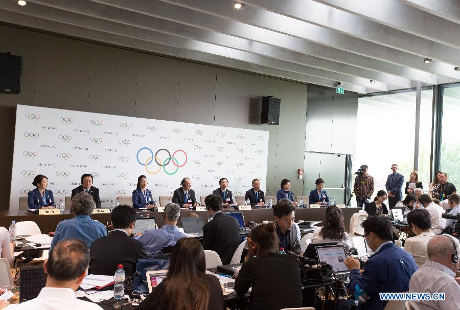 A general view shows the China Beijing 2022 Winter Olympics bid delegation groups at the press conference after presentation of Beijing Candidate City's bid for the 2022 Winter Olympic games, at the IOC Museum in Lausanne, Switzerland, on June 9, 2015.
