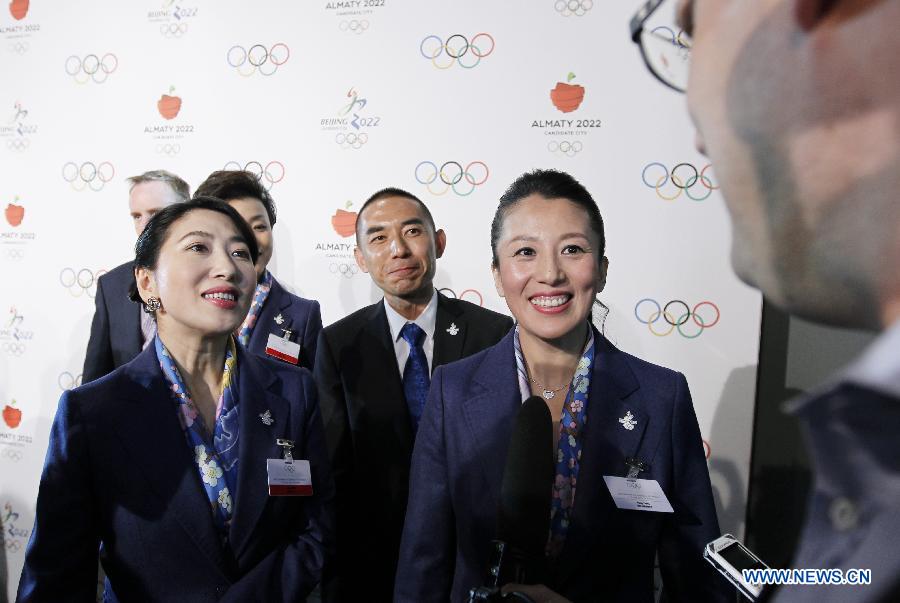 Yang Yang (R), Olympic champion of Shorttrack Speed Skating and IOC member, speaks to the media after the briefing for International Olympic Committee (IOC) members by the 2022 Winter Olympic Games candidate city of Beijing at the IOC Museum in Lausanne, Switzerland, on June 9, 2015.