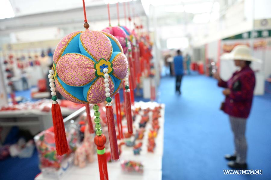 Hand-woven creations are displayed during an intangible cultural heritages show in Harbin, capital of northeast China's Heilongjiang Province, June 11, 2015.