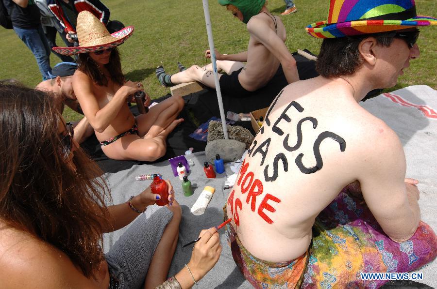 Participants take part in a protest against oil dependency and car culture during the 2015 World Naked Bike Ride on June 14, 2015 in Vancouver, Canada.