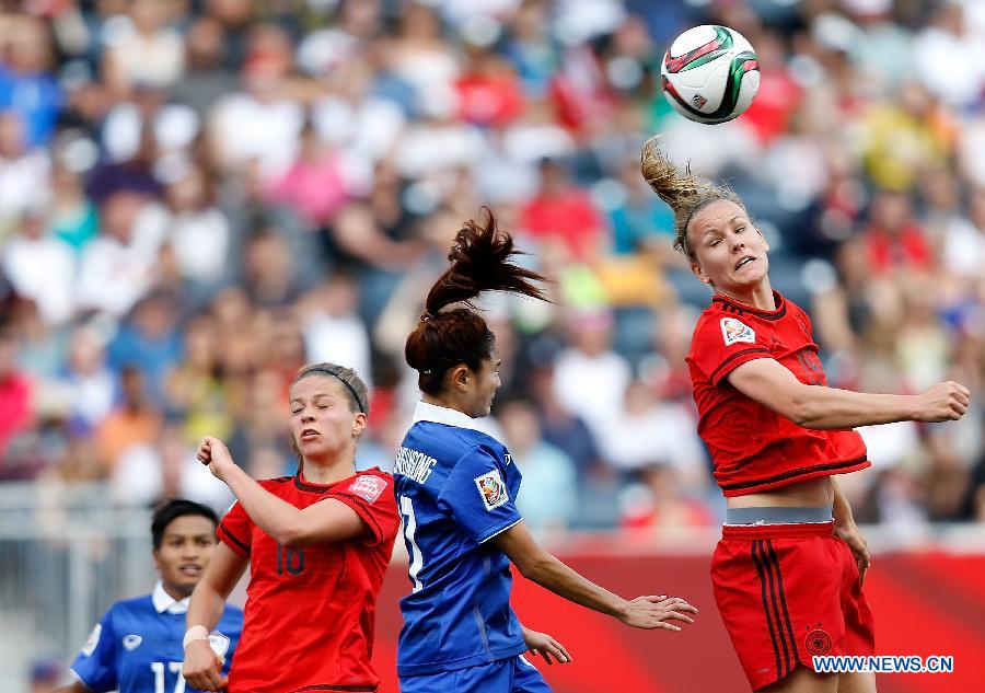 Lena Lotzen of Germany vies with Sunisa Srangthaisong of Thailand during the Group B match between Germany and Thailand at Winnipeg Stadium in Winnipeg, Canada on June 15, 2015. 