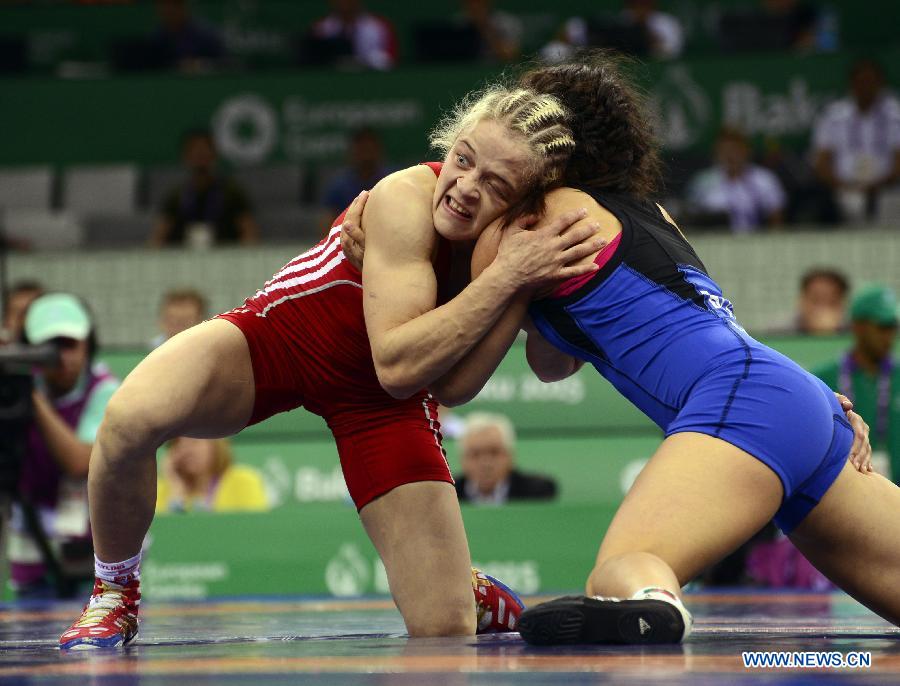 Maria Stadnik (L) of Azerbaijan competes in the final of women's 48kg wrestling event at the European Games in Azerbaijan's capital of Baku on June 15, 2015. 