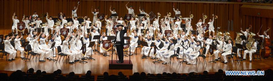 Bandsmen of a student wind band from Beijing No. 2 Experimental Primary School perform at the National Center for the Performing Arts in Beijing, capital of China, June 16, 2015. 
