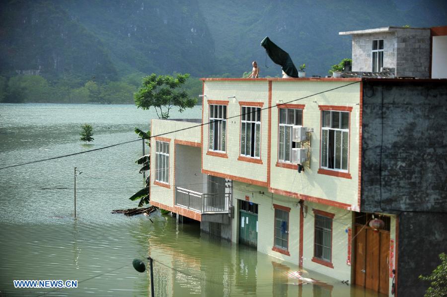 A house is flooded at Longchang Village in Mashan County, southwest China's Guangxi Zhuang Autonomous Region, June 16, 2015. 