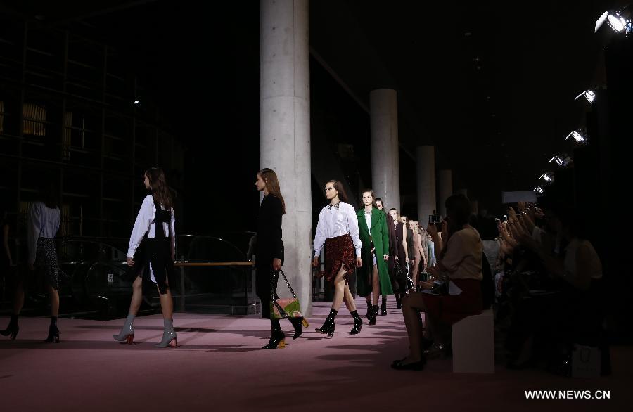 Models display creations of Christian Dior during its 2015-16 fall/winter fashion show in Tokyo, on June 16, 2015.