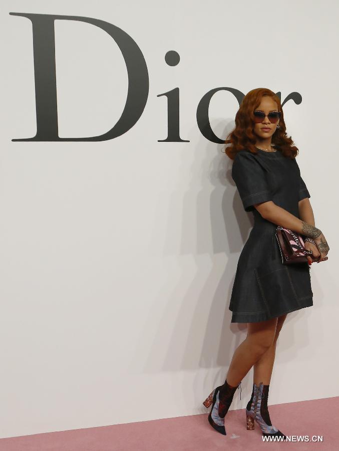 Singer Rihanna poses for pictures ahead of Christian Dior's 2015-16 fall/winter fashion show in Tokyo, on June 16, 2015. 