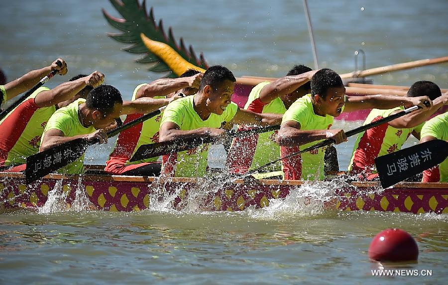 Participants compete in a dragon boat race in Chengmai, a county in south China's Hainan Province, on June 18, 2015.