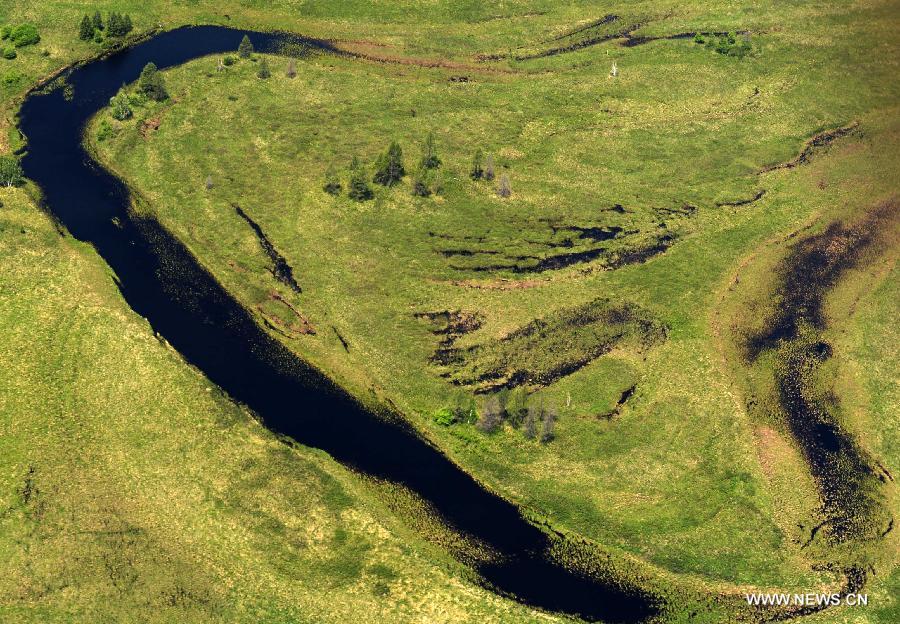 Photo taken on June 18, 2015 shows an aerial view of the Nanwenghe wetland in northeast China's Heilongjiang Province. Nanwenghe Nature Reserve, located in eastern Daxing'anling forest area, is the only protective wetland ecosystems in the cold temperate regions of China. 