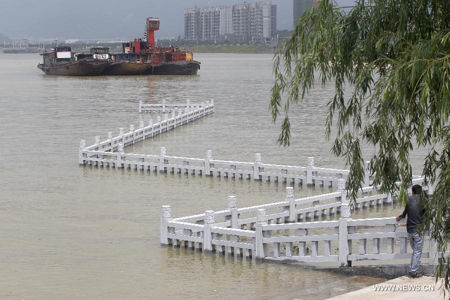A viewing deck is flooded in the Xingzi water area of Poyang Lake in east China's Jiangxi Province, June 19, 2015. 