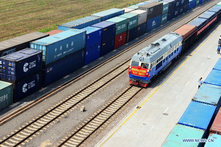 The 'Qingdao' freight train heading to Central Asia sets off from the central station of CRIntermodal in Qingdao, a port city in east China's Shandong Province, July 1, 2015.