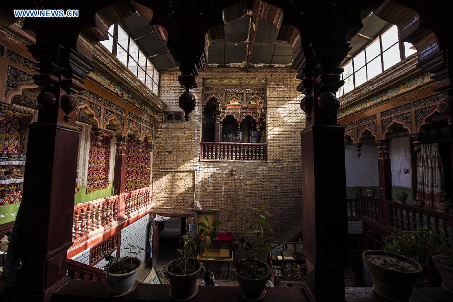 Photo taken on June 4, 2015 shows a house with a history of 400 years in the old town of the old town of Kax, northwest China's Xinjiang Uygur Autonomous Region. 