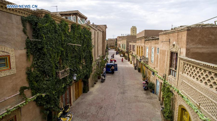 Photo taken on July 6, 2015 shows street scene of the old town of Kax, northwest China's Xinjiang Uygur Autonomous Region. 