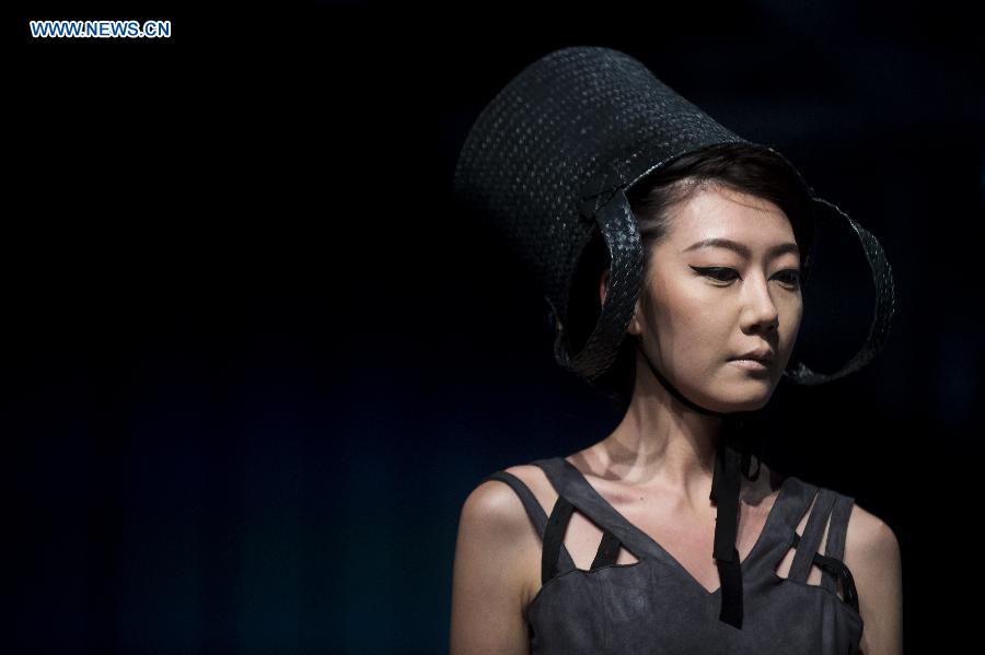 A model shows a creation at the 22nd Hong Kong Fashion Week for Spring/Summer in Hong Kong, south China, July 8, 2015. 