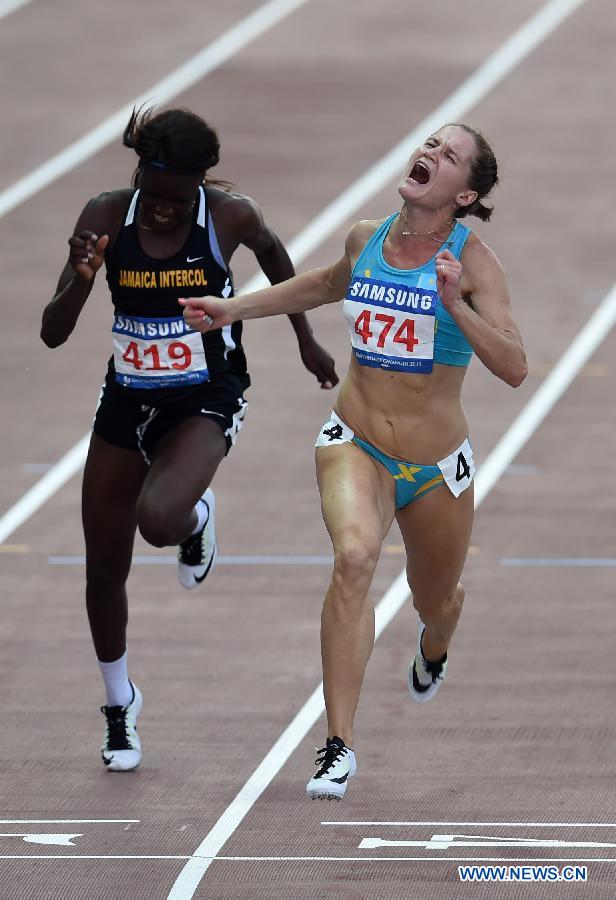 Viktoriya Zyabkina(R) of Kazakhstan competes during Women's 100m Final at the 28th Summer Universiade in Gwangju, South Korea, on July 9, 2015.