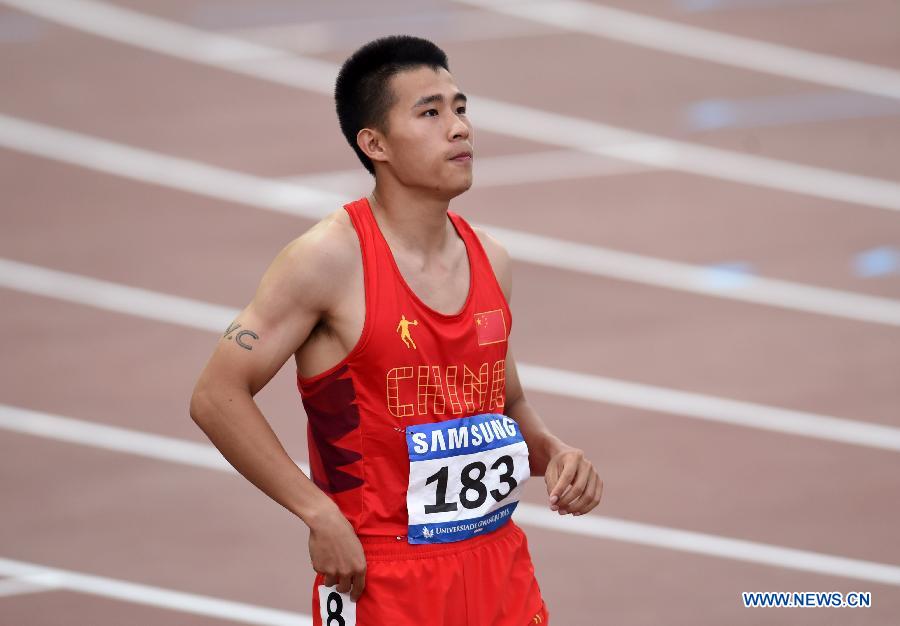 Yang Yang of China reacts after Men's 100m Final at the 28th Summer Universiade in Gwangju, South Korea, on July 9, 2015.