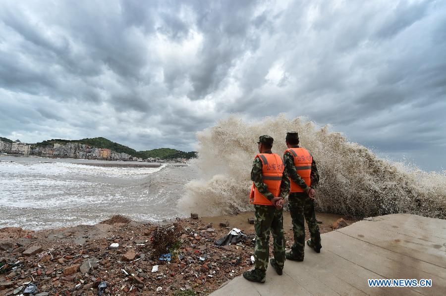 Frontier defence soldiers keep guard on the shore in Sansha Township of Xiapu, southeast China's Fujian Province, July 10, 2015. China is on highest alert as super typhoon Chan-Hom approaches the eastern coast at high speeds.
