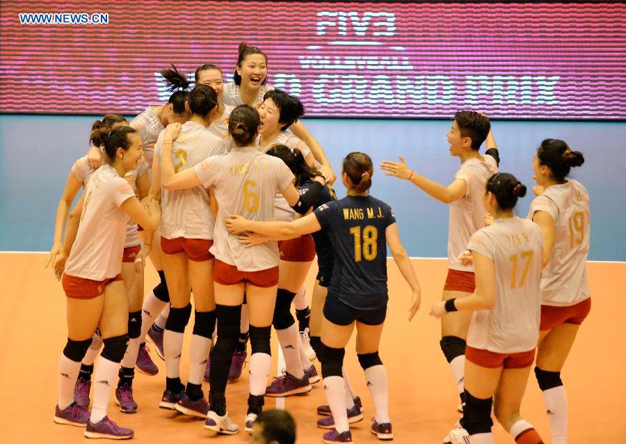 Players of China celebrate after their match against Japan at the 2015 FIVB Volleyball World Grand Prix in Saitama, Japan, July 12, 2015.