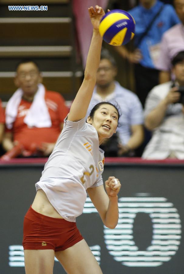 Zhu Ting of China spikes the ball during their match against Japan at the 2015 FIVB Volleyball World Grand Prix in Saitama, Japan, July 12, 2015.