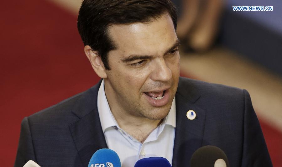 Greek Prime Minister Alexis Tsipras speaks to press after the 17-hour Euro Summit at the EU headquarters in Brussels, Belgium, July 13, 2015.