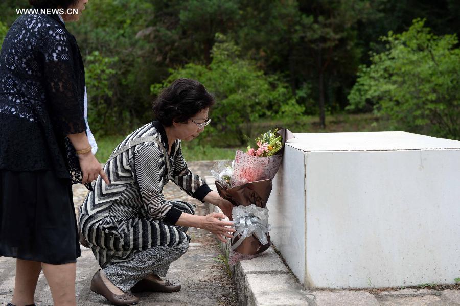 Japanese citizens, who were adopted by Chinese people during the World War II, visit a memorial hall as they visit a cemetery to memorize adoptive Chinese parents in Fangzheng County near Harbin, capital of northeast China's Heilongjiang Province, July 13, 2015. 