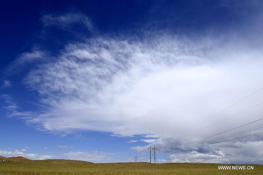 Photo taken on July 15, 2015 shows the scenery of clouds above prairie in Urad Middle Banner of Bayannur City, north China's Inner Mongolia Autonomous Region.