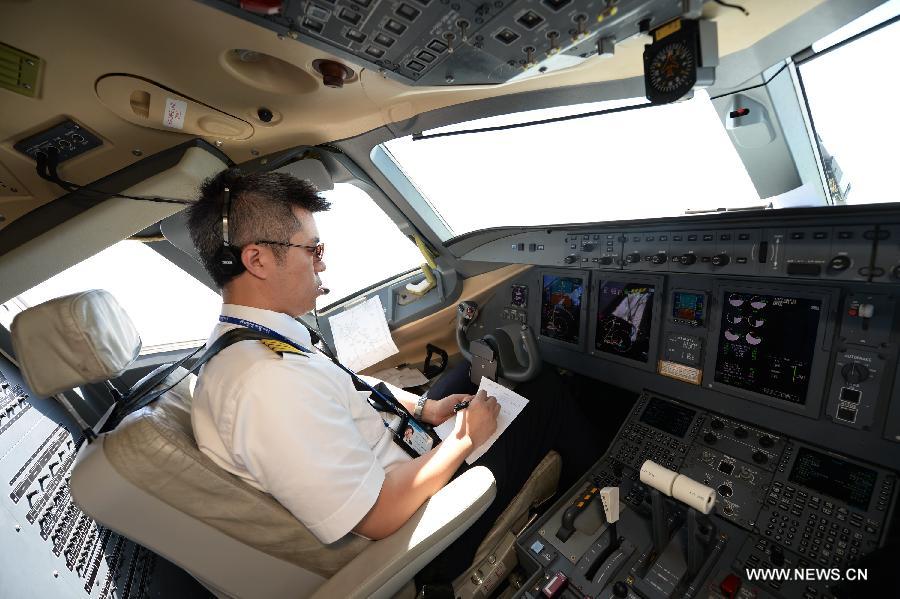 The polit of the ARJ21-700 jet conducts a demonstration flight in Xi'an, capital city of northwest China's Shaanxi Province, July 17, 2015. 