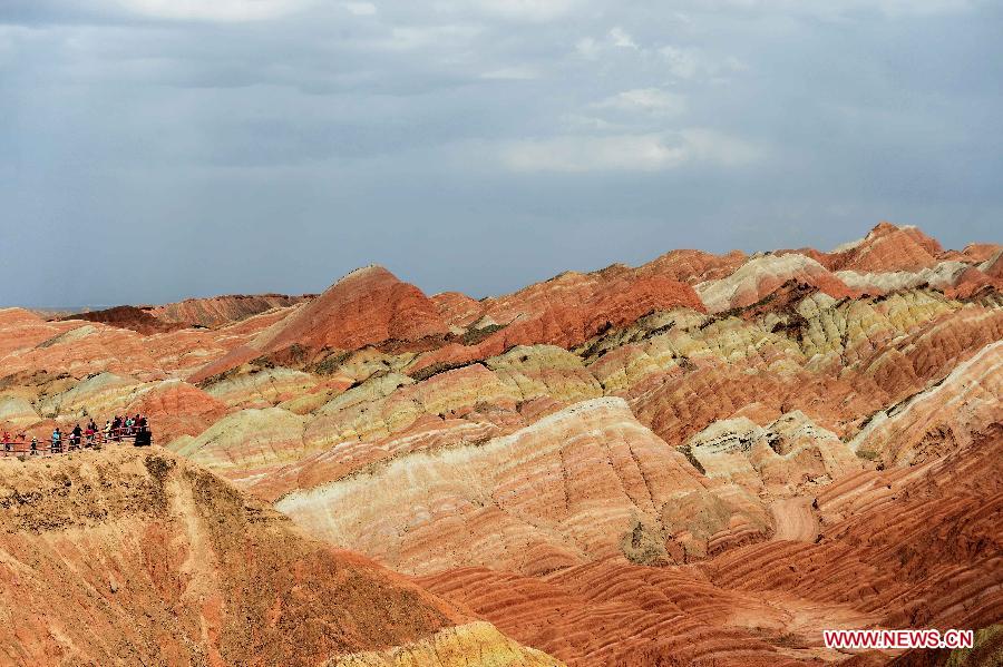 People visit the Danxia landform at the Zhangye Danxia National Geological Park in Zhangye, northwest China's Gansu Province, July 16, 2015. (Xinhua/Qiao Qiming) 