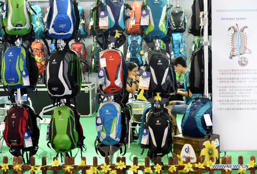 Photo taken on July 23, 2015 shows an outdoor backpack stand during the Asia Outdoor Trade Show 2015 in Nanjing, capital of east China's Jiangsu Province. 