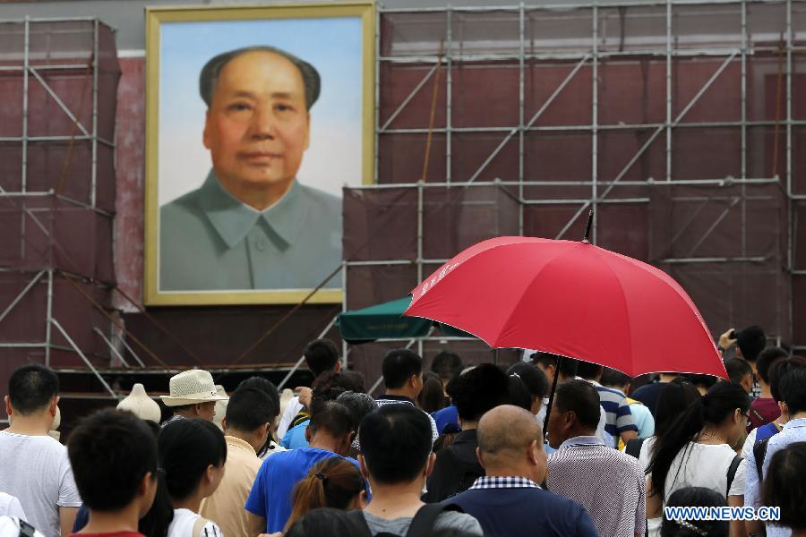 Tourists visit Tian'anmen in Beijing, capital of China, July 23, 2015. 