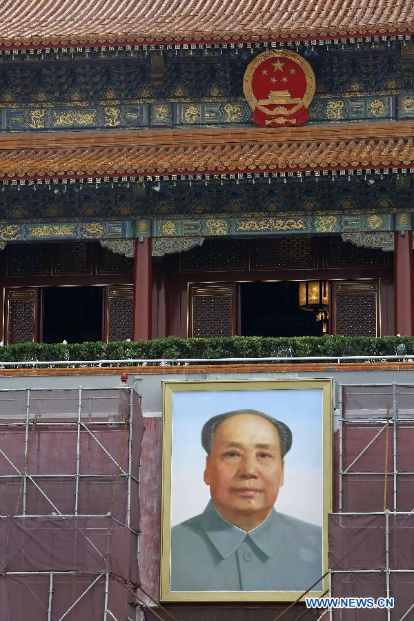 Workers paint walls of Tian'anmen Rostrum in Beijing, capital of China, July 23, 2015. 