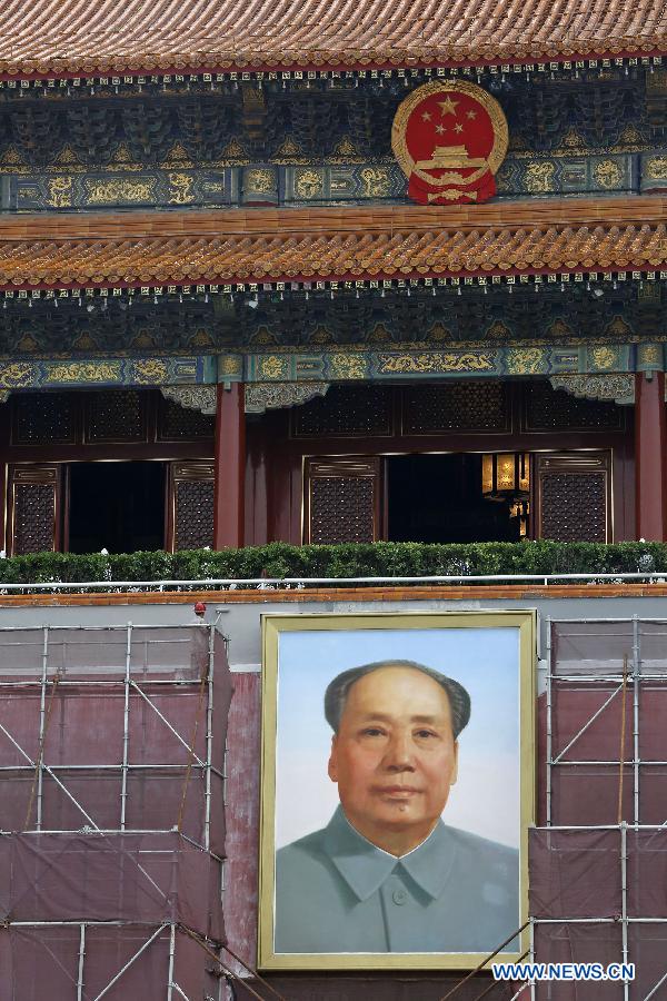 Workers paint walls of Tian'anmen Rostrum in Beijing, capital of China, July 23, 2015. 