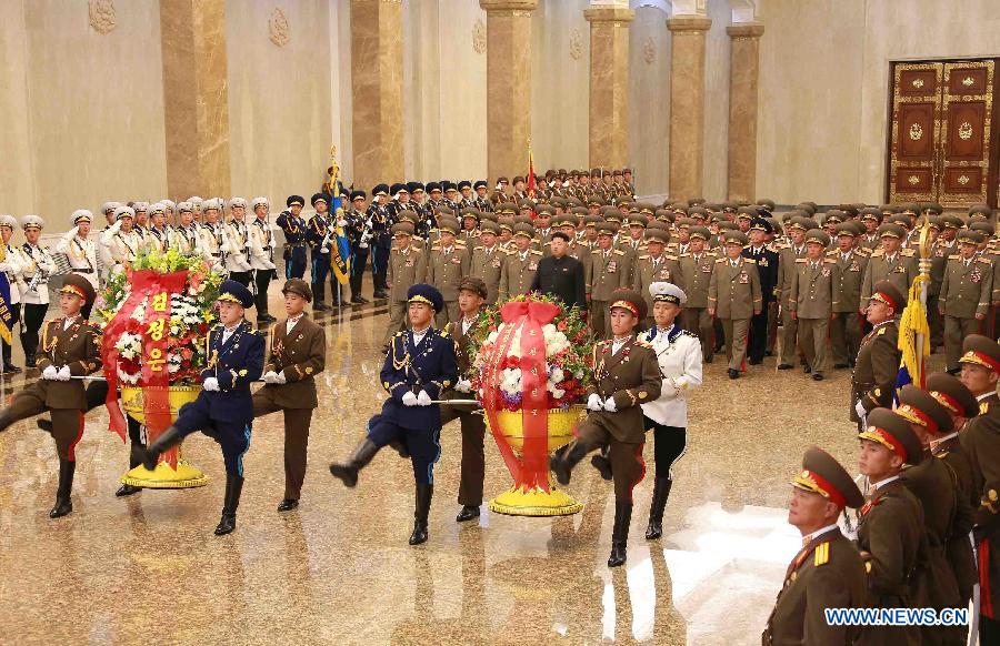 Photo provided by Korean Central News Agency (KCNA) on July 27, 2015 shows top leader of the Democratic People's Republic of Korea (DPRK) Kim Jong Un (C) visiting the Kumsusan Palace of the Sun on the occasion of the 62nd anniversary of the victory in the Fatherland Liberation War of the DPRK at 00:00, July 27. 