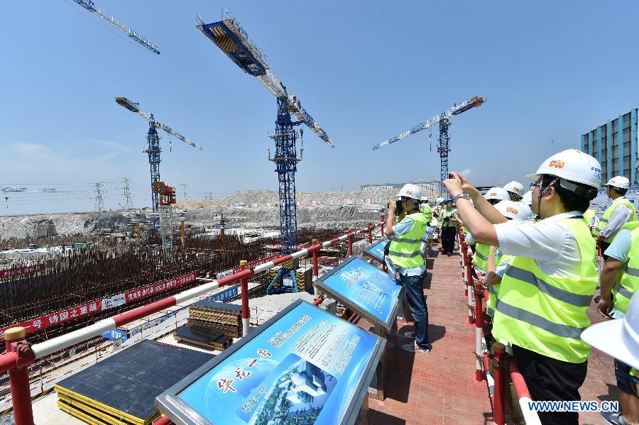 Public representatives and reporters visit a construction site of Hualong One pilot nuclear project in Fuqing, southeast China's Fujian Province, July 27, 2015.