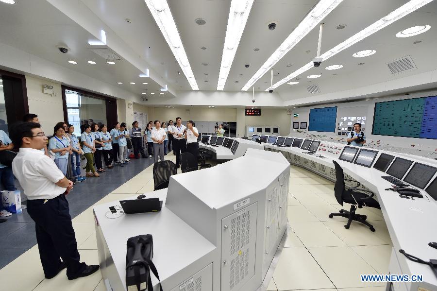 Public representatives and reporters visit a model reactor independently developed in China at Fuqing Nuclear Power Co., Ltd. of China National Nuclear Power Corporation (CNNC) in Fuqing, southeast China's Fujian Province, July 27, 2015.