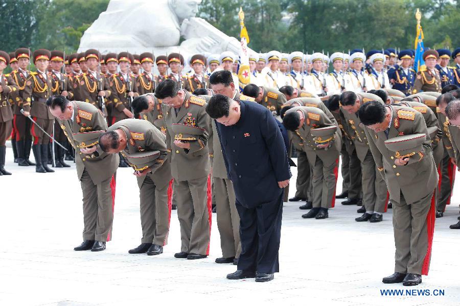 Photo provided by Korean Central News Agency (KCNA) on July 28, 2015 shows top leader of the Democratic People's Republic of Korea (DPRK) Kim Jong Un (C, back) visiting the Fatherland Liberation War Martyrs Cemetery on the occasion of the 62nd anniversary of the victory in the great Fatherland Liberation War of the DPRK, to pay high tribute to the fallen fighters of the People's Army on July 27, 2015. 