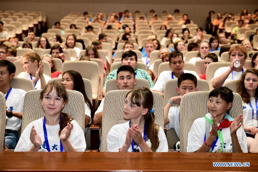 Russian students attend a lecture on traditional Chinese culture at Shandong University in Jinan, capital of east China's Shandong Province, July 30, 2015. Russian middle school students at a summer camp arrived in Shandong on Thursday to experience Chinese culture and interact with Chinese peers in Jinan, Qufu and Weihai. (Xinhua/Guo Xulei) 