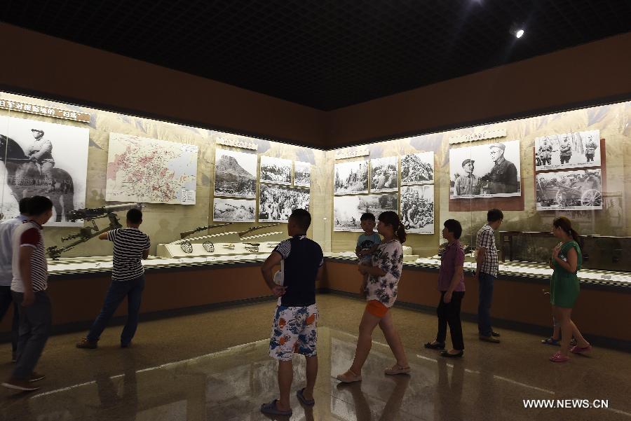 People visit the Taihang Memorial Hall of the Eighth Route Army in Wuxiang County, north China's Shanxi Province, July 29, 2015. The memorial hall was opened to the public in 1988 to depict the history of the Communist-led Eighth Route Army in the Chinese People's War of Resistance Against Japanese Aggressions from 1937 to 1945). (Xinhua/Yan Yan) 