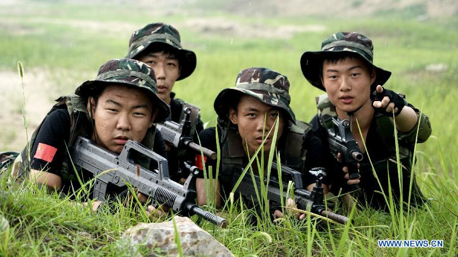Students participate in a military summer camp in Beijing, capital of China, July 29, 2015. The military summer camp for youths, located in the Daxing District of Beijing, has attracted more than 15,000 students from across the country since 2008, when it was opened. (Xinhua/Li Xin) 