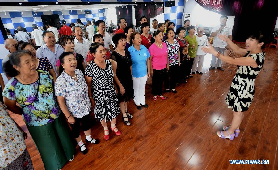 An elderly chorus practice in a cultural center in Yongqing County, north China's Hebei Province, July 30, 2015. Various free training classes organized by Yongqing Cultural Center have attracted more than 300 seniors and enriched their cultural life. (Xinhua/Li Xiaoguo) 