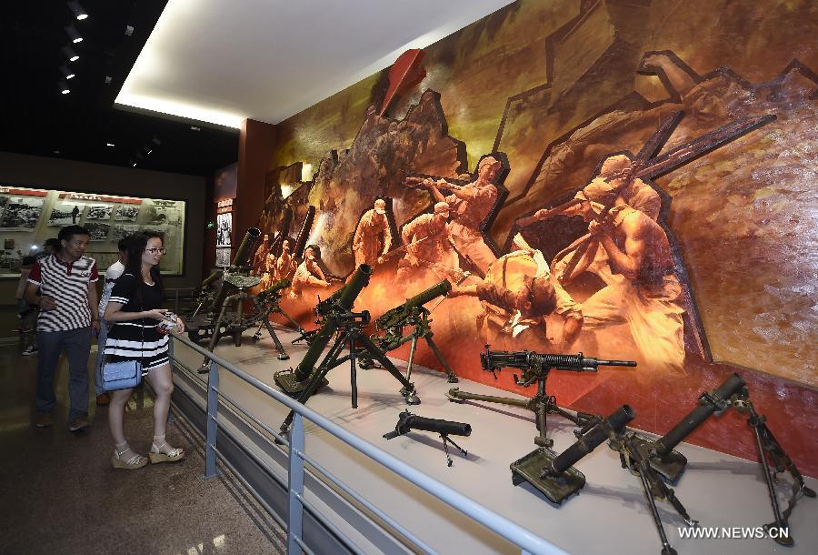 People visit the Taihang Memorial Hall of the Eighth Route Army in Wuxiang County, north China's Shanxi Province, July 29, 2015. The memorial hall was opened to the public in 1988 to depict the history of the Communist-led Eighth Route Army in the Chinese People's War of Resistance Against Japanese Aggressions from 1937 to 1945). (Xinhua/Yan Yan) 