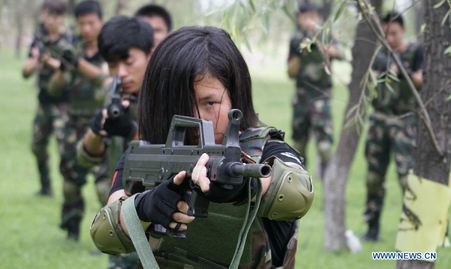 Students participate in a military summer camp in Beijing, capital of China, July 29, 2015. The military summer camp for youths, located in the Daxing District of Beijing, has attracted more than 15,000 students from across the country since 2008, when it was opened. (Xinhua/Li Xin) 