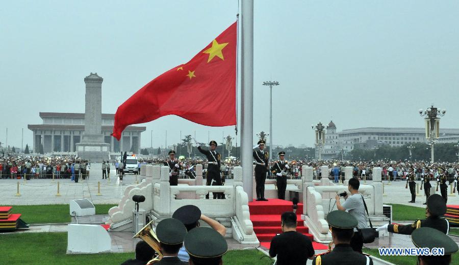 A national flag-raising ceremony is held at the Tian'anmen Square in Beijing, capital of China, Aug. 1, 2015 to celebrate the 88th anniversary of the founding of the Chinese People's Liberation Army, and Beijing and Zhangjiakou's winning the bid for hosting the 2022 Winter Olympics. (Xinhua/Tang Zhaoming) 