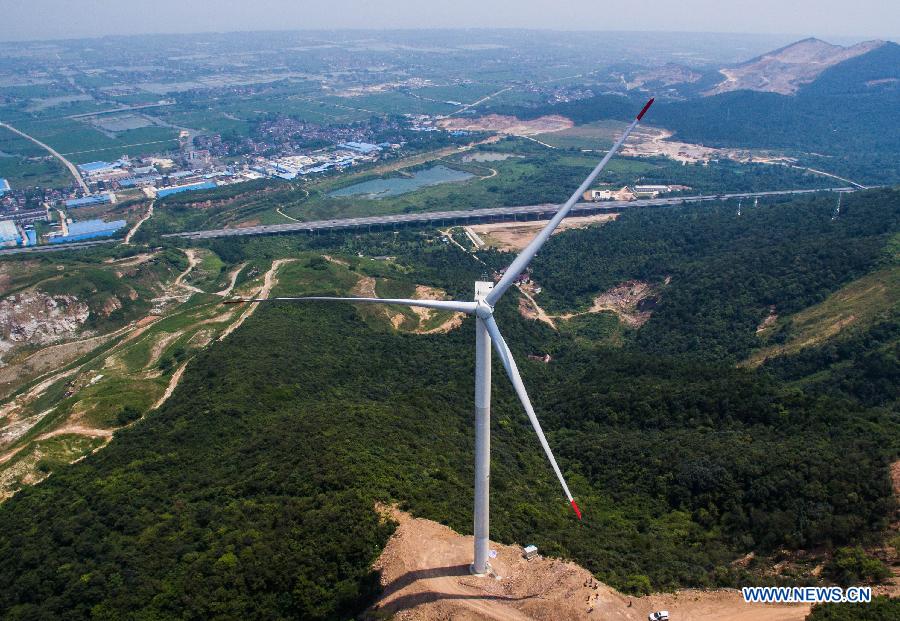 A low wind speed wind farm achieves grid connection and commissions in Changxing County, east China's Zhejiang Province, Aug. 5,2015. 