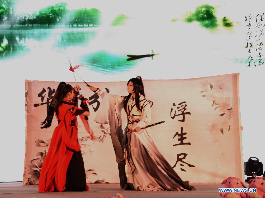 Cosplayers perform during the 2015 Yunnan Cultural Industry Expo in Kunming, capital city of southwest China's Yunnan Province, Aug. 7, 2015. 