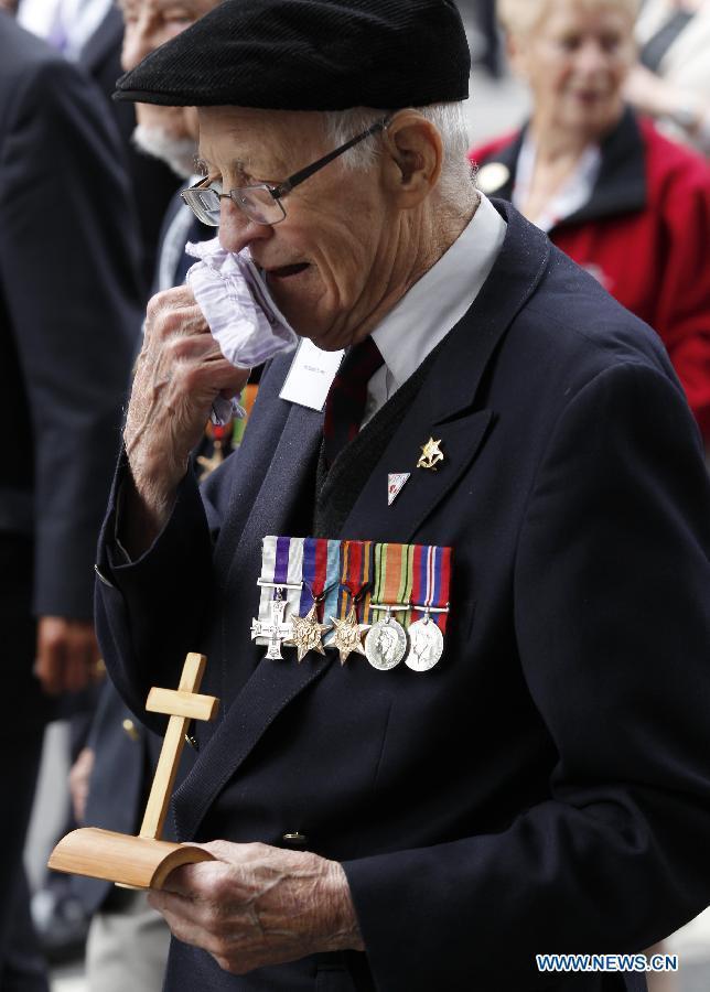 A veteran is seen in a parade from Horse Guards Parade to Westminster Abbey after a service of commemoration during the 70th Anniversary commemorations of VJ Day (Victory over Japan) in London, Britain, on Aug. 15, 2015. (Xinhua/Han Yan) 