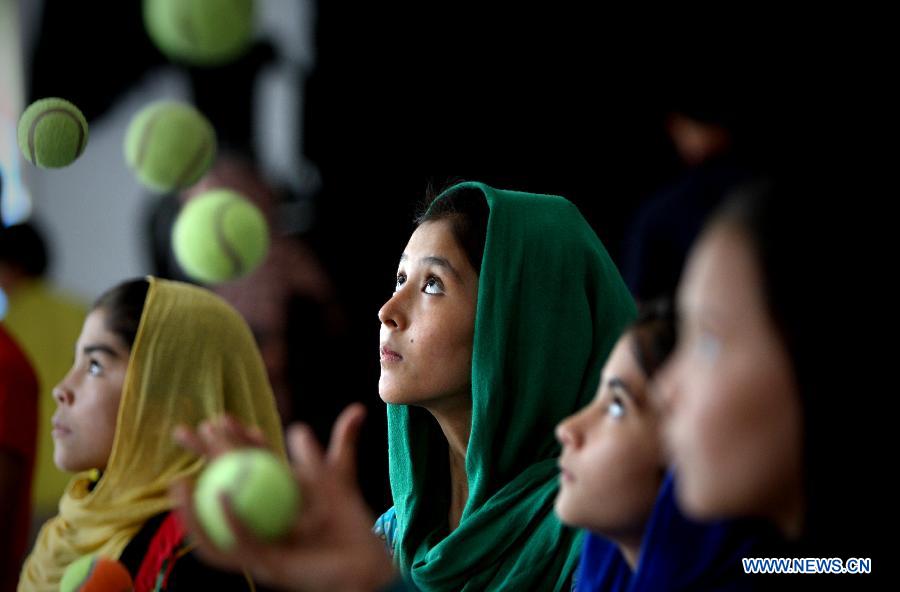 Afghan children from the Mobile Mini Circus for Children perform during the National Juggling Championship in Kabul, Afghanistan, Aug. 12, 2015. 